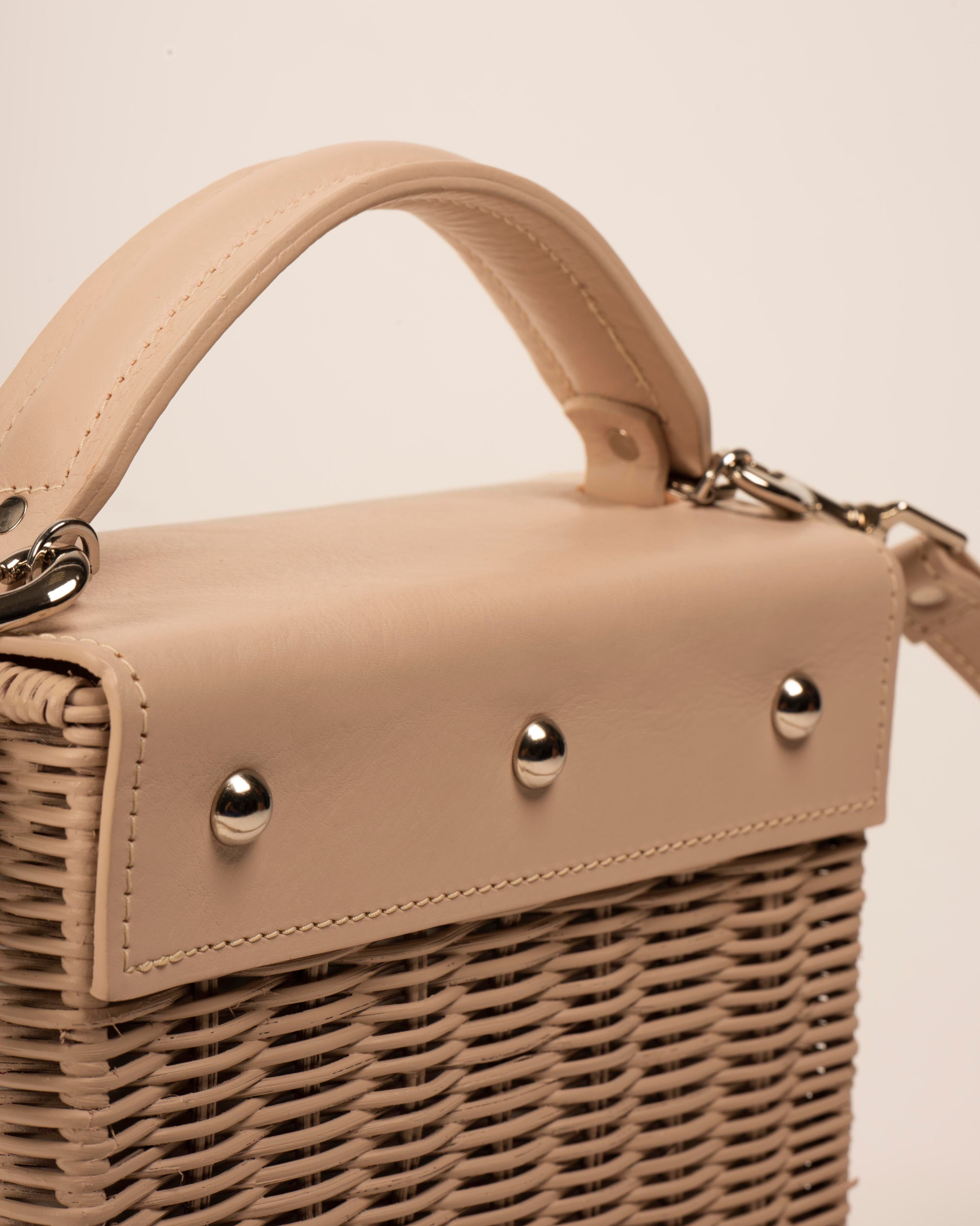 Wicker Wings Kuai handwoven wicker bag in cream, studded detailing