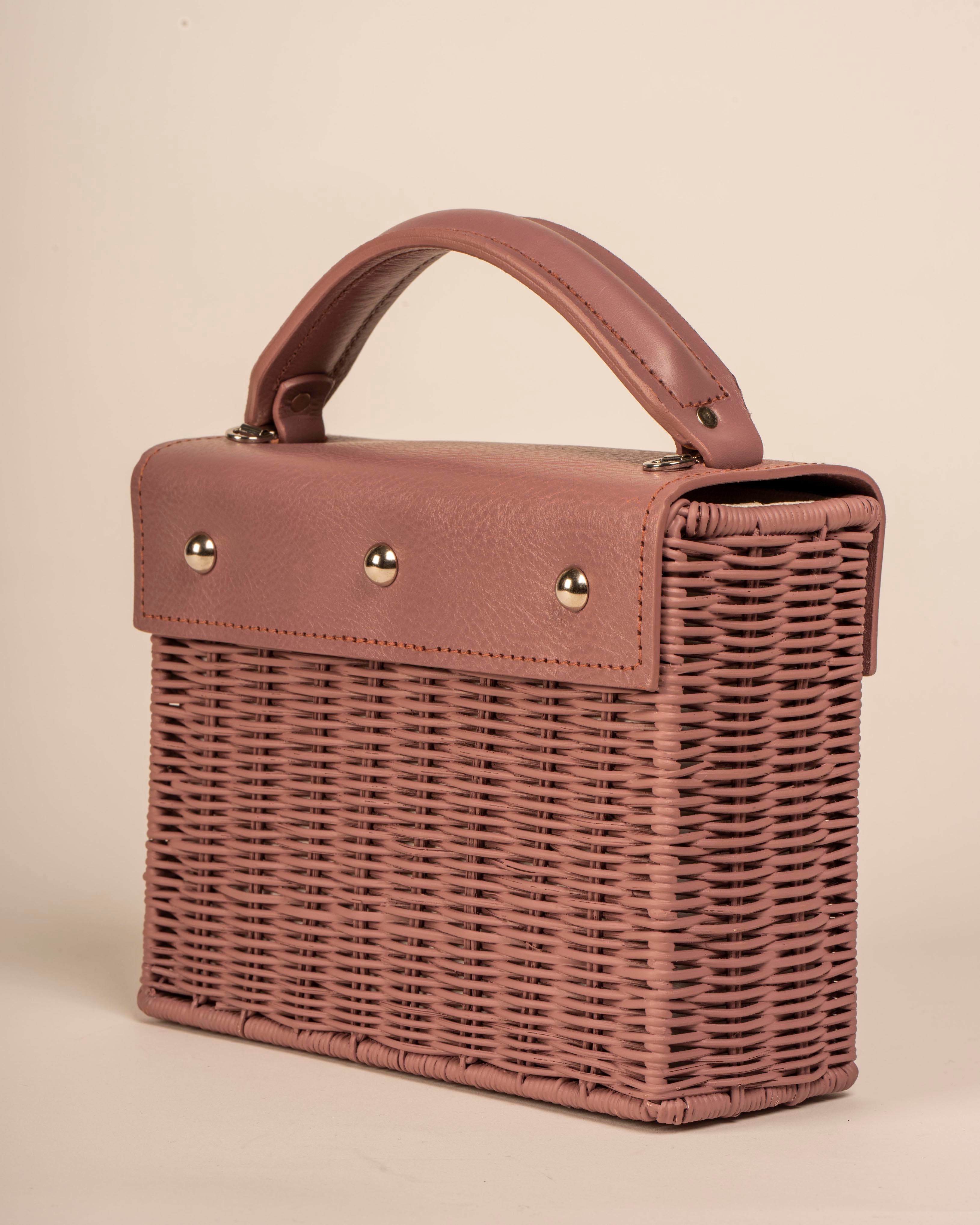 Wicker Wings handwoven Kuai dusk bag, in profile.