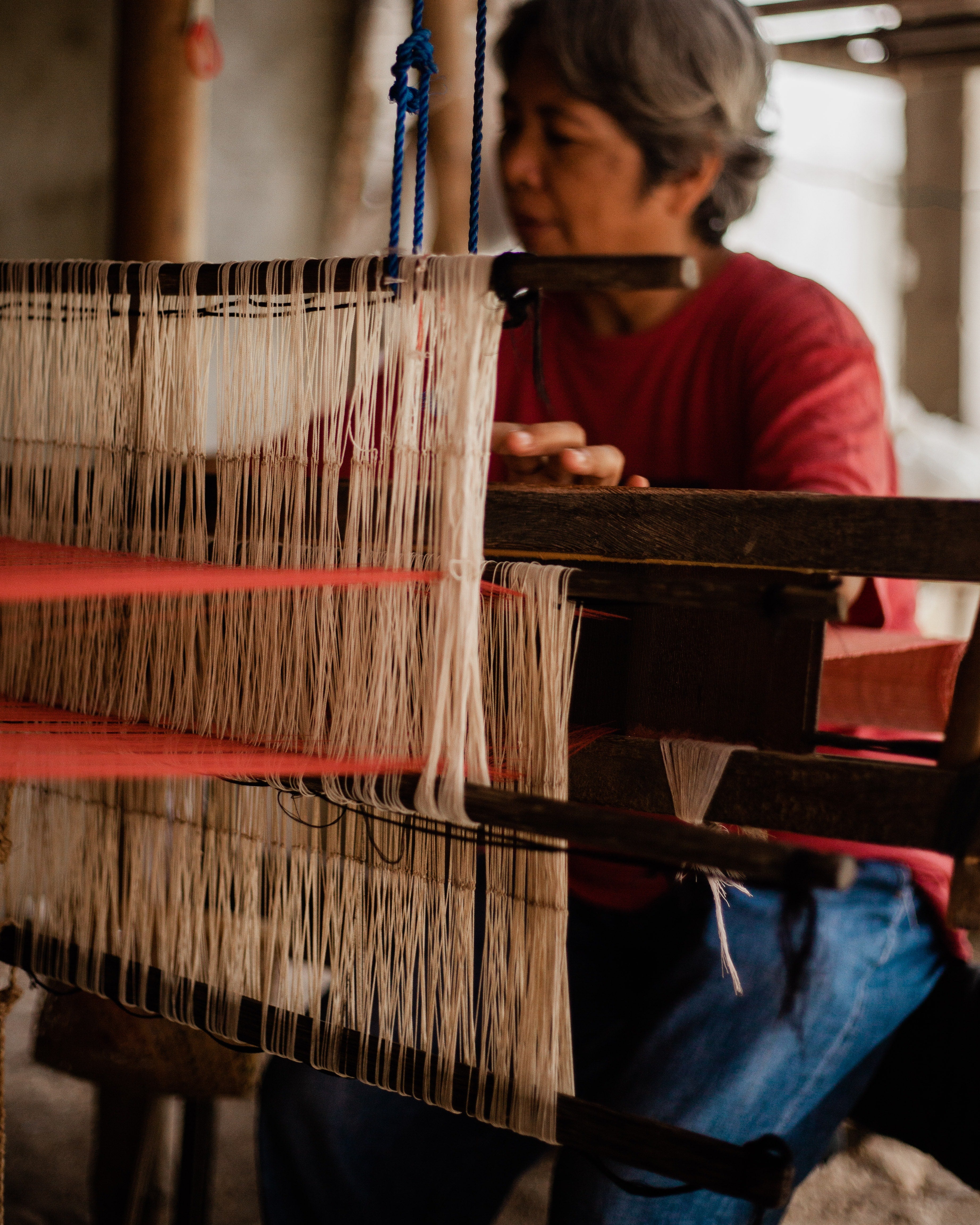 woman weaving, photo by Ralph Labay.