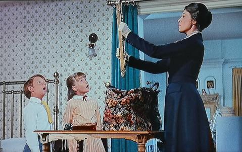 Image still from Mary Poppins, extracting items from her magic bag.