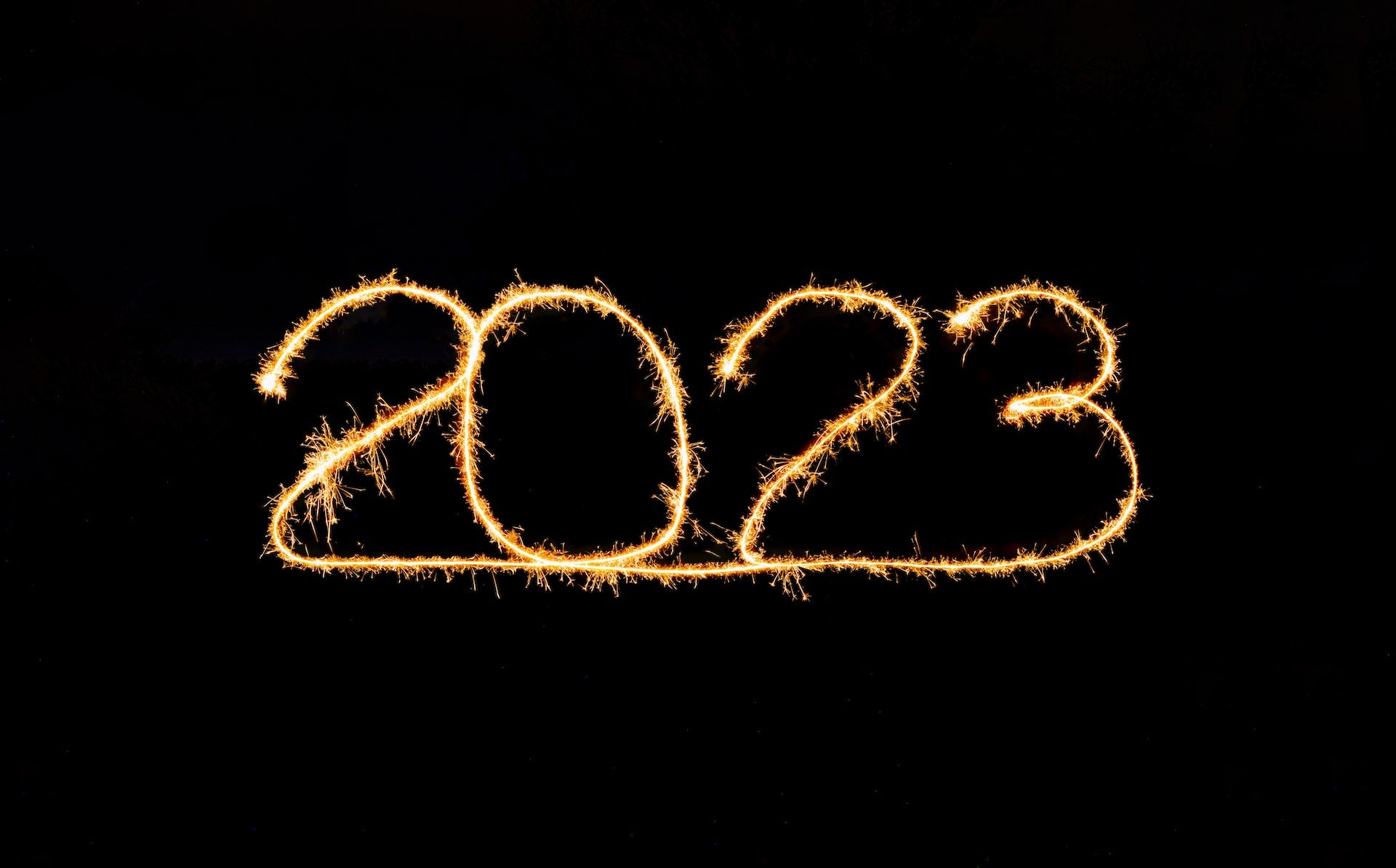 2023 written by a sparkler, unsplash image